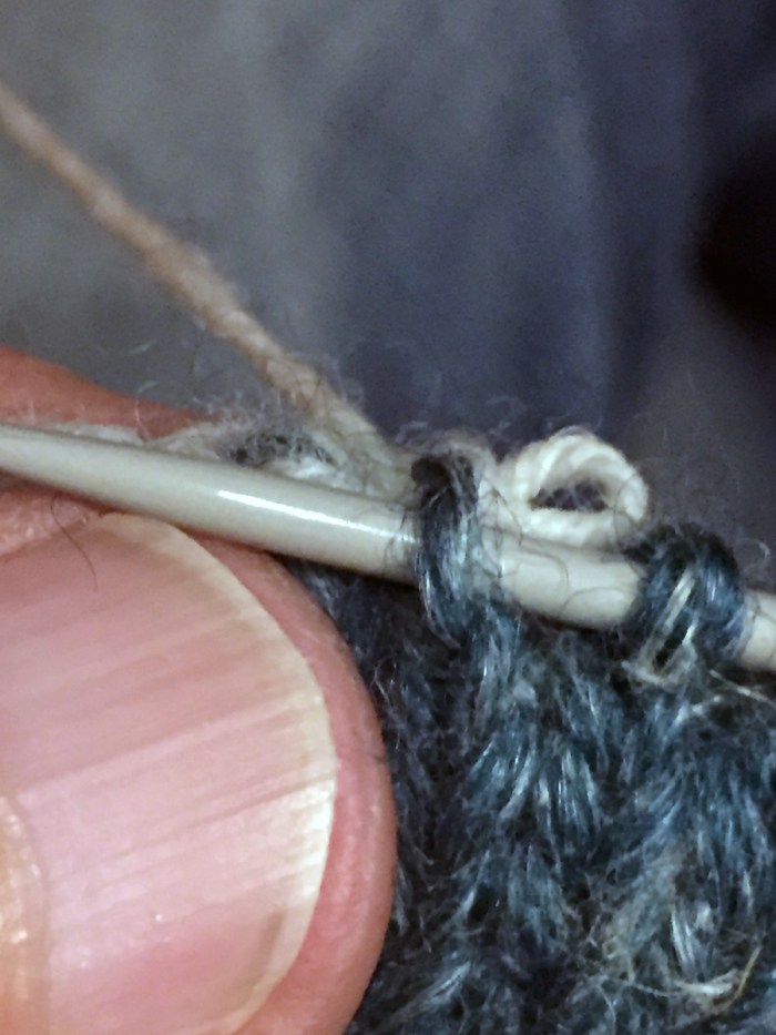 Unraveling the provisional cast-on and picking up the life stitches